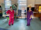 Hospital staff wearing scrubs made by the local group